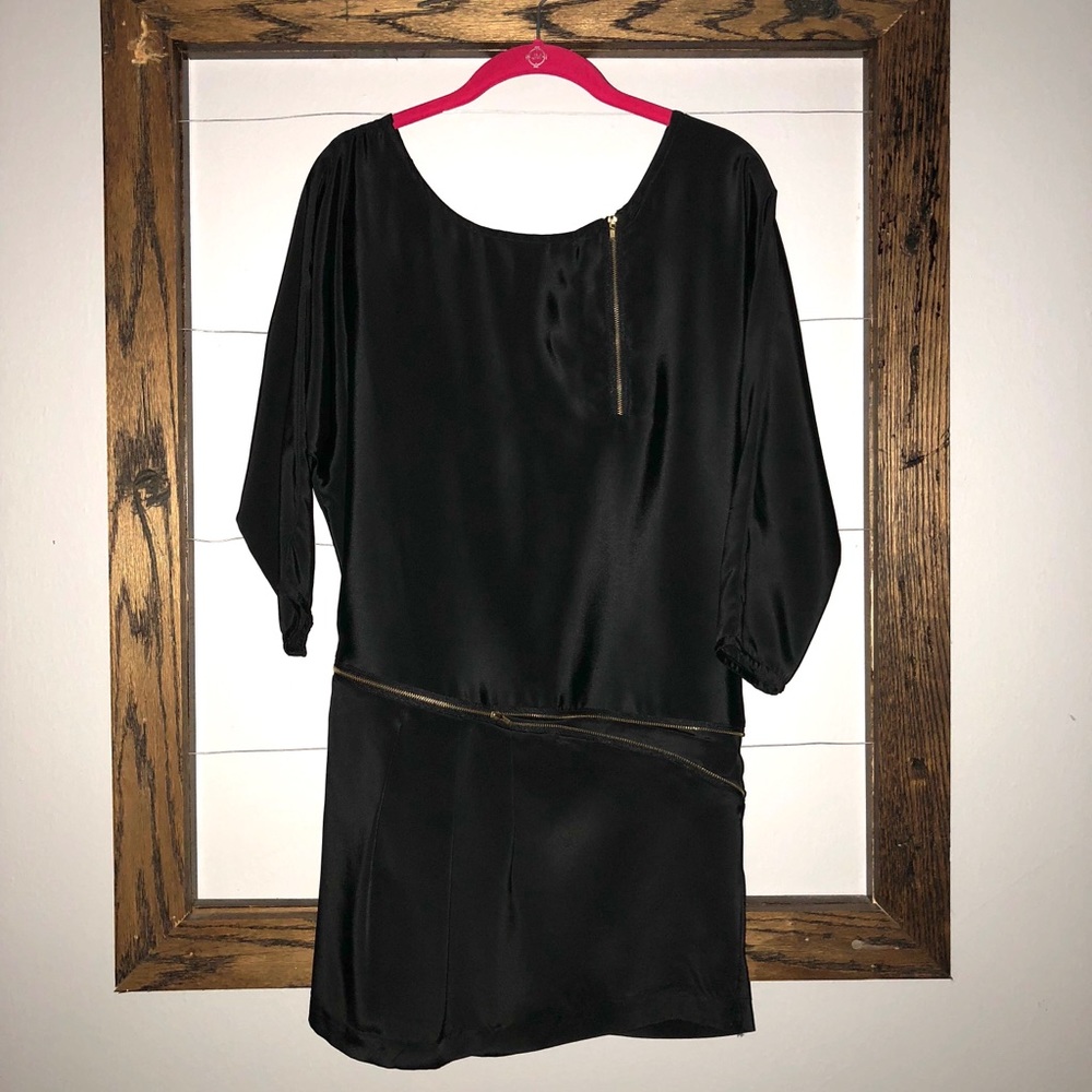 Black mini dress with gold zipper